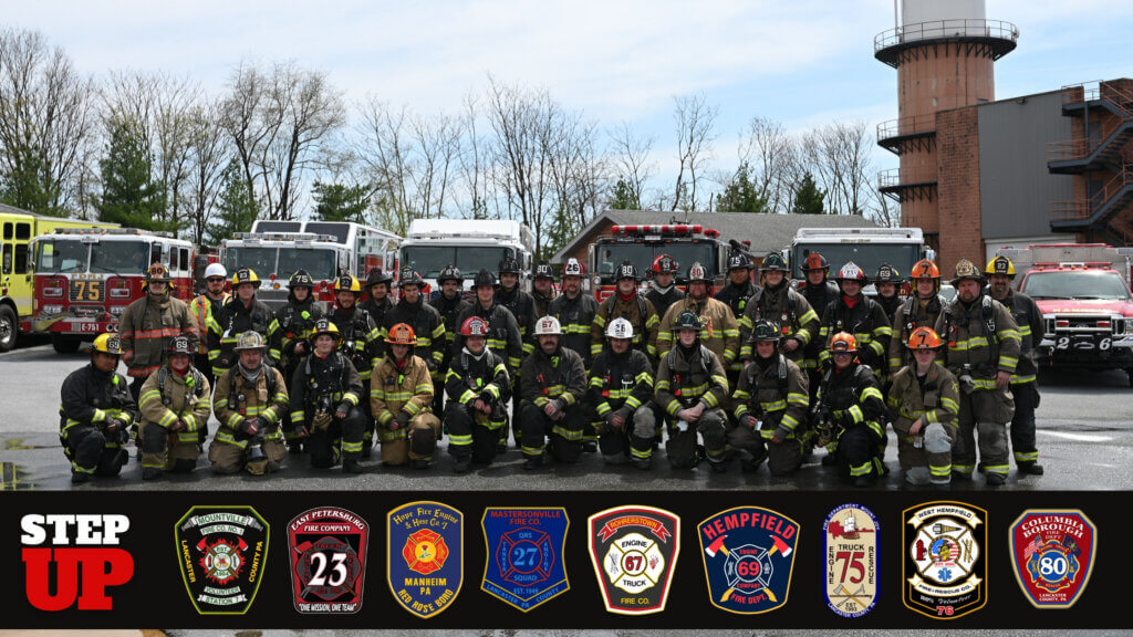 Joining the Fire Department several joint-departments pose for a photo op